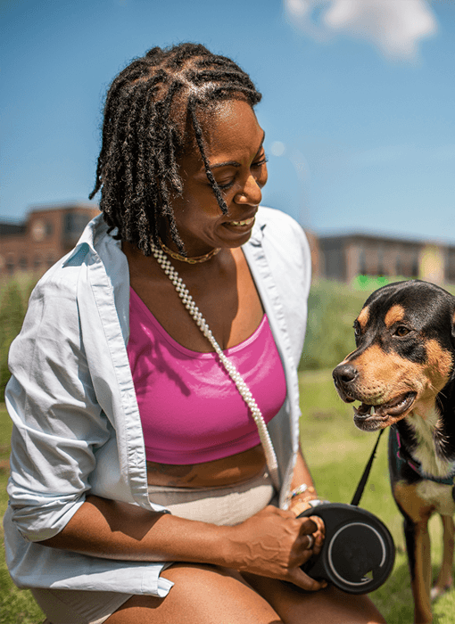 woman in pink with her dog