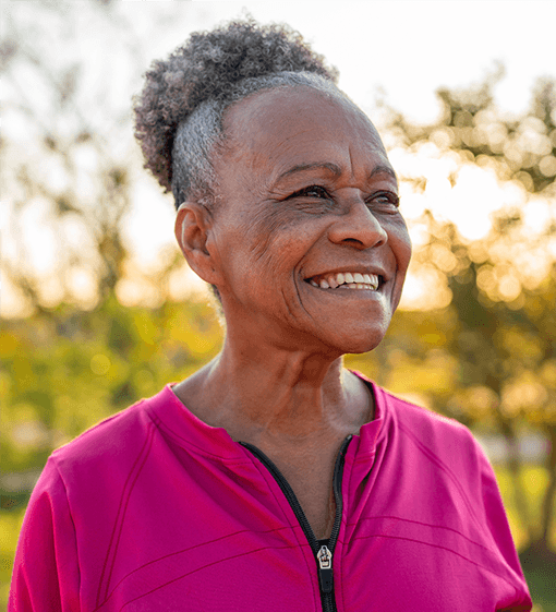 Mature woman in pink smiling